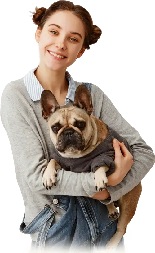 smiling woman carrying pug dog