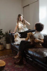 two womans with dog at home